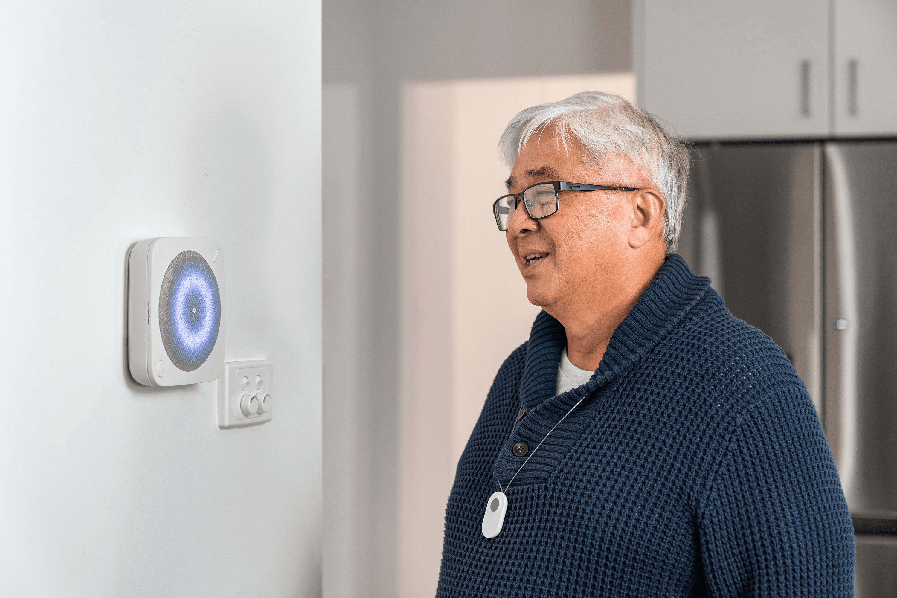 Umps Home Alarm hub and pendant in a home setting
